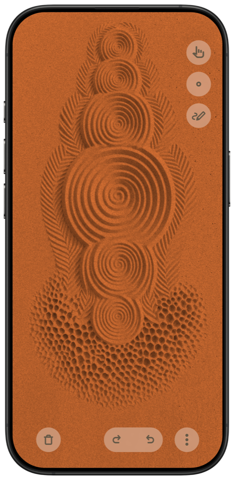SandPlay running on an iPhone, showing patterns drawn in orange sand
